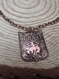 Rustic Brass Colored Rodeo Pendant Necklace – 22" Western Cowgirl Statement Jewelry